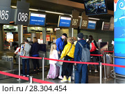 Moscow, Russia - April 4. 2018. Passengers at check-in of airline Rossiya in Vnukovo airport. Редакционное фото, фотограф Володина Ольга / Фотобанк Лори