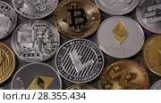 A lot of metal coins of crypto currency LTC, ETH, BTC, XMR, XRP, DASH on a dark background. Slow motion. 1080p Full HD video. Стоковое видео, видеограф Ярослав Данильченко / Фотобанк Лори