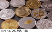 Physical metal cryptocurrency on a dark background. Digital coins cyberspace. Slow motion. 1080p Full HD video. Стоковое видео, видеограф Ярослав Данильченко / Фотобанк Лори