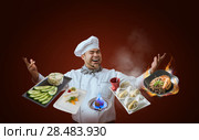 Chef presenting new menu. Стоковое фото, агентство Ingram Publishing / Фотобанк Лори