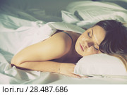 Young female in pygamas is sleeping on bed. Стоковое фото, фотограф Яков Филимонов / Фотобанк Лори