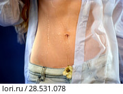 Sexual woman drinking water from bottle, pours on breasts. Стоковое фото, фотограф Gennadiy Poznyakov / Фотобанк Лори