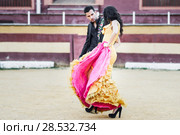 Portrait of a pretty couple, models of fashion, in a bullring. Spanish style. Стоковое фото, фотограф Javier Sánchez Mingorance / Ingram Publishing / Фотобанк Лори