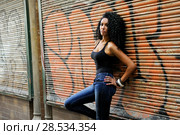 Portrait of a young black woman, model of fashion in urban background. Стоковое фото, фотограф Javier Sánchez Mingorance / Ingram Publishing / Фотобанк Лори