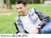 Portrait of a young handsome man, model of fashion, with modern hairstyle smiling in urban background. Стоковое фото, фотограф Javier Sánchez Mingorance / Ingram Publishing / Фотобанк Лори