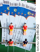 Moscow, Russia - June 8, 2018: Preparing to enter matches of confederations Cup in 2017 and World Cup 2018 in Russia. Tickets on toy football. Редакционное фото, фотограф Papoyan Irina / Фотобанк Лори