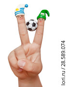 Two fingers in the clay caps with a soccer ball isolated on white background. Players Uruguay and Saudi Arabia. Стоковое фото, фотограф Элина Гаревская / Фотобанк Лори