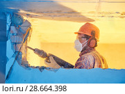 worker with demolition hammer breaking interior wall. Стоковое фото, фотограф Дмитрий Калиновский / Фотобанк Лори