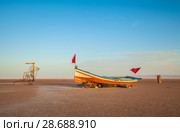 A wooden boat at the large salt lake Chott El Jerid, Tunisia. Morning time. October. Стоковое фото, фотограф Сергей Цепек / Фотобанк Лори