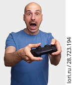 frightened middle aged man playing video game. Стоковое фото, фотограф Александр Лычагин / Фотобанк Лори