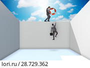Businessman saving colleague with lifebuoy. Стоковое фото, фотограф Elnur / Фотобанк Лори