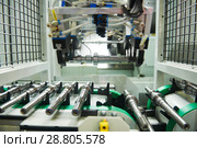 robotized automated conveyor for detail supply into cnc machining center. Стоковое фото, фотограф Дмитрий Калиновский / Фотобанк Лори
