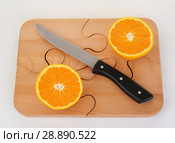 Orange pieces on a wooden board and knife. Стоковое фото, фотограф Георгий Ильин / Фотобанк Лори