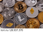 Many different coins of crypto currency on a dark background. Business and technology concept. Top view. Стоковое фото, фотограф Ярослав Данильченко / Фотобанк Лори