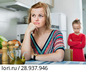 Upset girl and mother have a peeve on each other. Стоковое фото, фотограф Яков Филимонов / Фотобанк Лори