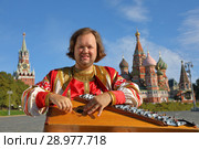Minstrel with music instrument gusli. Стоковое фото, фотограф Алексей Кузнецов / Фотобанк Лори