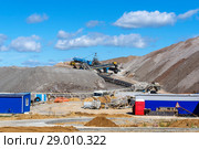 Dumps of mined rock with belt conveyors, stackers and working bulldozer, general view. Стоковое фото, фотограф Евгений Харитонов / Фотобанк Лори