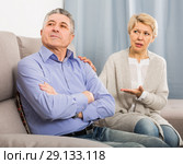 upset mature couple quarreling at home with each other. Стоковое фото, фотограф Яков Филимонов / Фотобанк Лори