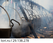 Iron cauldrons for cooking in open fire. Стоковое фото, фотограф Яков Филимонов / Фотобанк Лори