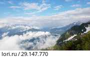 Caucasian mountains in early spring from Rosa Khutor resort in Russia. Стоковое видео, видеограф Володина Ольга / Фотобанк Лори