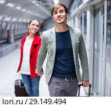 Portrait of couple with wheeled trollers. Стоковое фото, фотограф Яков Филимонов / Фотобанк Лори