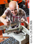 worker making nameboard. Стоковое фото, фотограф Яков Филимонов / Фотобанк Лори