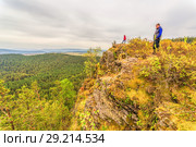 A man stands on a rock and opens his arms in breadth. Стоковое фото, фотограф Акиньшин Владимир / Фотобанк Лори
