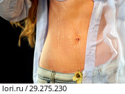 Sexual woman drinking water from bottle, pours on breasts. Стоковое фото, фотограф Gennadiy Poznyakov / Фотобанк Лори