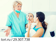 Unhappy woman in clinic of esthetic medicine. Стоковое фото, фотограф Яков Филимонов / Фотобанк Лори