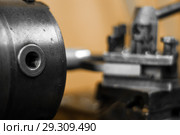 Background - detail of the machine, the spindle of turning lathe while working close up, the background is blurred. Стоковое фото, фотограф Евгений Харитонов / Фотобанк Лори