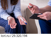 Patient discussing with psychologist unplanned pregnancy. Стоковое фото, фотограф Elnur / Фотобанк Лори