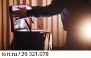 A man opening case with light in it and looking inside. Стоковое видео, видеограф Константин Шишкин / Фотобанк Лори