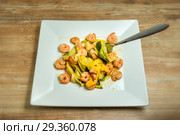 Plate with homemade shrimp scampi zucchini noodles. Стоковое фото, фотограф Игорь Бородин / Фотобанк Лори