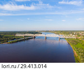 A panorama from a height, a typical small city in central Russia and the river Vyatka with railroad bridge. Стоковое фото, фотограф Mikhail Starodubov / Фотобанк Лори