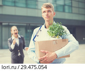 Serious man is standing upset near office. Стоковое фото, фотограф Яков Филимонов / Фотобанк Лори