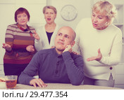 Mature woman is warm apologizing to man after quarrel. Стоковое фото, фотограф Яков Филимонов / Фотобанк Лори