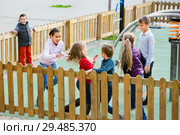 Group of children playing romp game Touch-last outdoors. Стоковое фото, фотограф Яков Филимонов / Фотобанк Лори