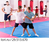 Kids practicing in pair self-protection. Стоковое фото, фотограф Яков Филимонов / Фотобанк Лори