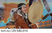 Pretty young woman in national clothing indigenous inhabitants Kamchatka beats tambourine and sings (2018 год). Редакционное видео, видеограф А. А. Пирагис / Фотобанк Лори