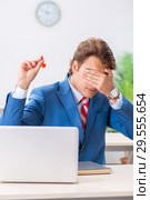 Businessman throwing dart in business concept. Стоковое фото, фотограф Elnur / Фотобанк Лори