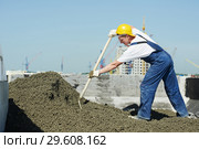 Roof construction. worker roofer leveling with float lute. Стоковое фото, фотограф Дмитрий Калиновский / Фотобанк Лори