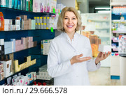 female pharmacist posing in drugstore. Стоковое фото, фотограф Яков Филимонов / Фотобанк Лори