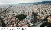 Aerial view of Barcelona and famous Sagrada Familia church, Catalonia, Spain (2018 год). Редакционное видео, видеограф Яков Филимонов / Фотобанк Лори