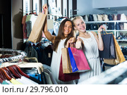 Two glad girls having many shopping bags. Стоковое фото, фотограф Яков Филимонов / Фотобанк Лори