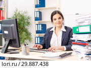 Female employee with too much work in the office. Стоковое фото, фотограф Elnur / Фотобанк Лори