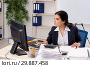 Female employee with too much work in the office. Стоковое фото, фотограф Elnur / Фотобанк Лори