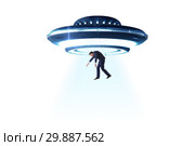 Flying saucer abducting young businessman. Стоковое фото, фотограф Elnur / Фотобанк Лори