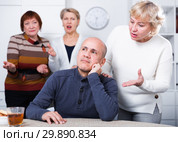 Mature woman is warm apologizing to man after quarrel. Стоковое фото, фотограф Яков Филимонов / Фотобанк Лори