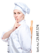 the chef hides the rolling pin behind his back and shows a finger gesture quieter, a portrait on a white background is isolated. Стоковое фото, фотограф Константин Лабунский / Фотобанк Лори