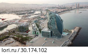 View from drone of Barceloneta beach with luxury hotel W Barcelona (2018 год). Стоковое видео, видеограф Яков Филимонов / Фотобанк Лори
